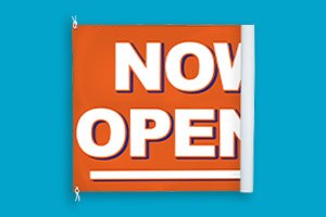 A vinyl banner that says Yes, We're Open